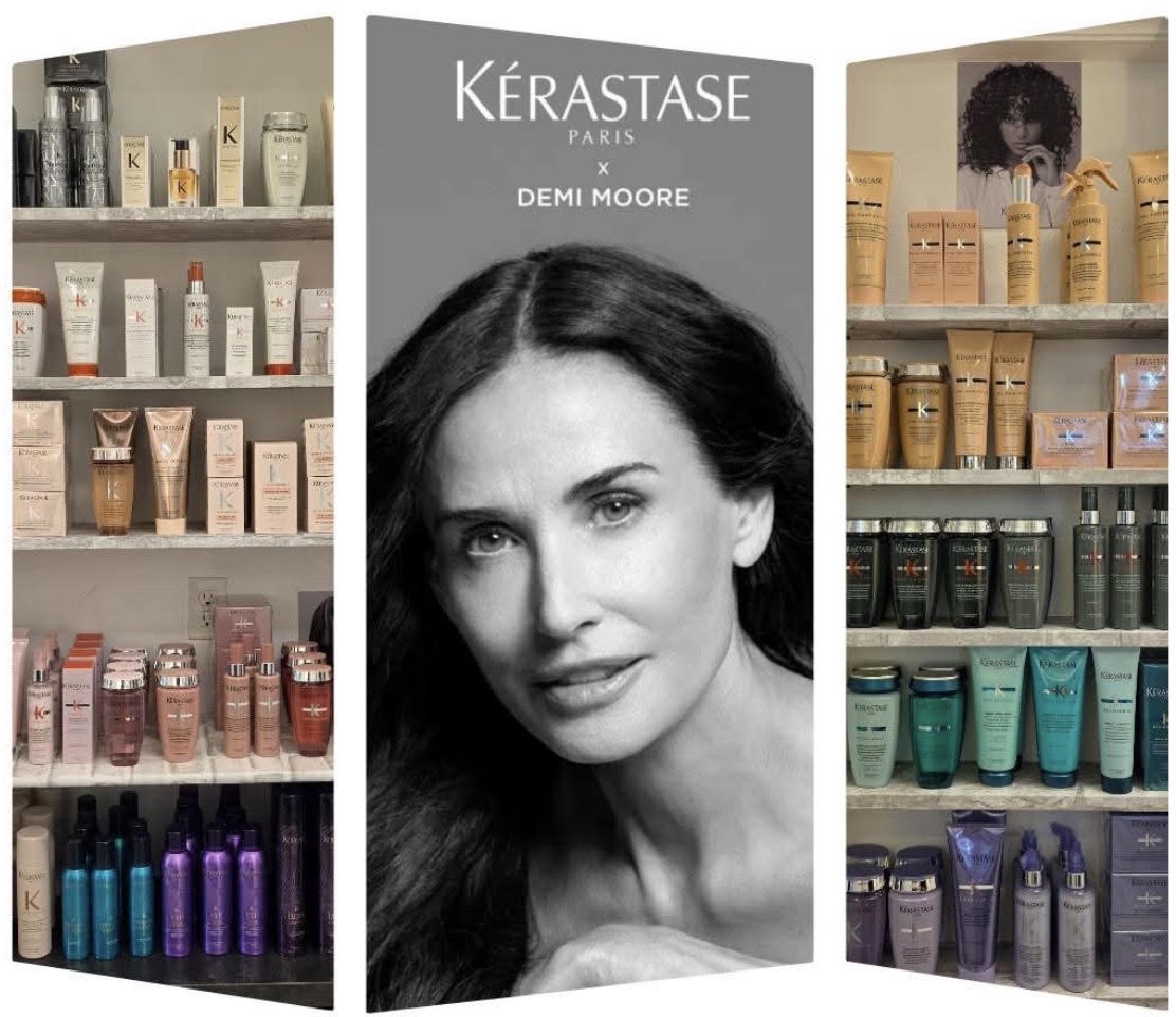 Kérastase Paris x Demi Moore campaign portrait, flanked by the salon's shelves of Kérastase hair care